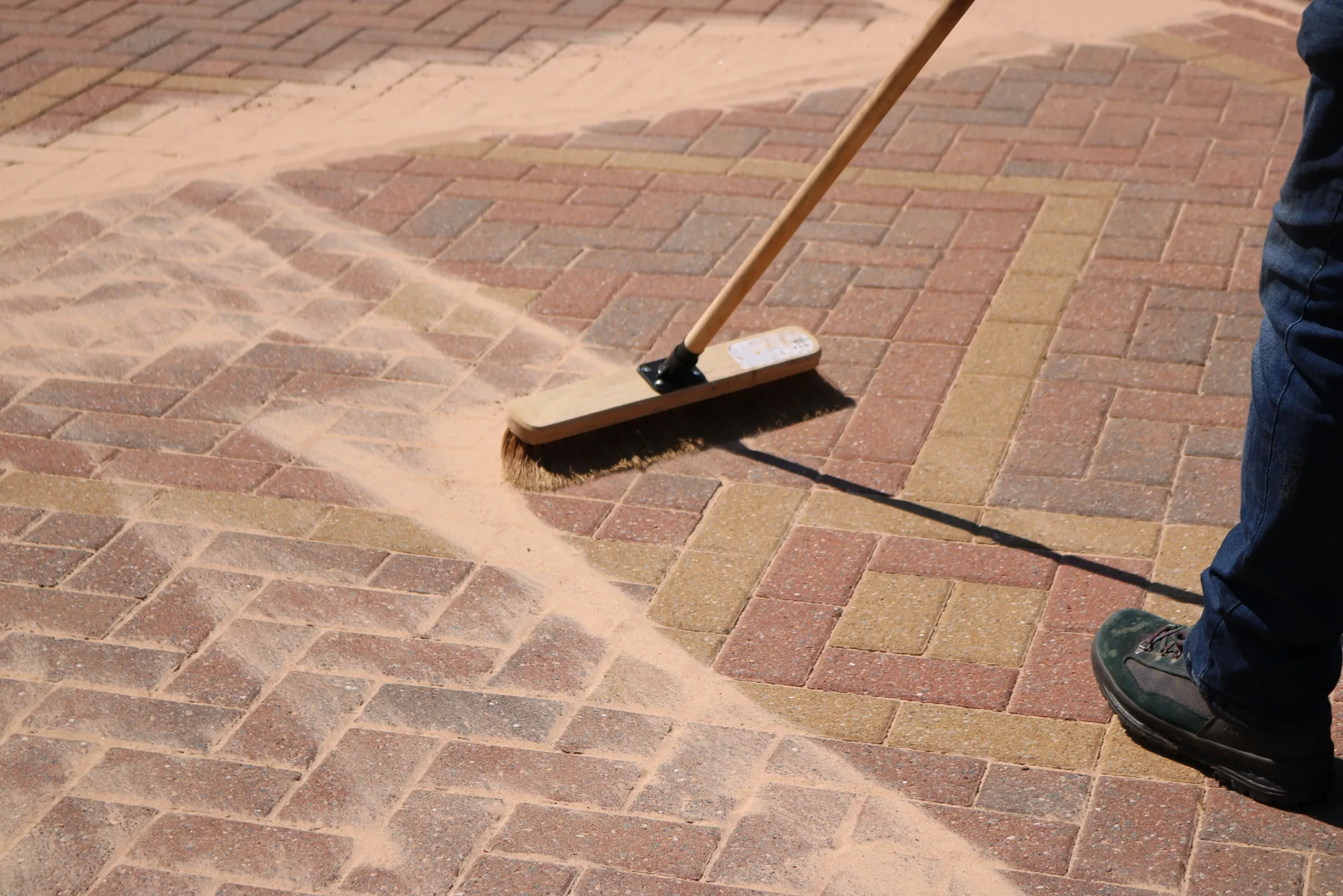Paver sanding with polymeric sand